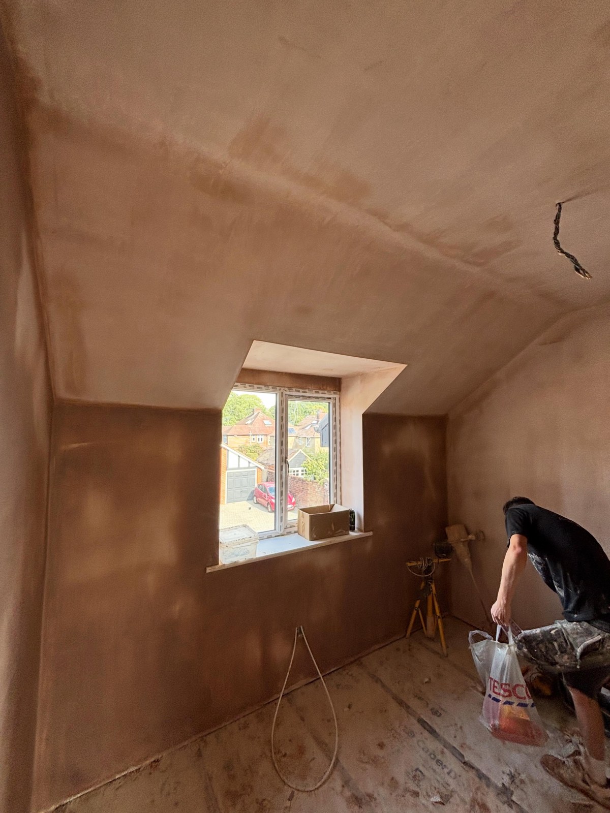Newly plastered sloping ceiling and walls on an Ash Plastering interior project