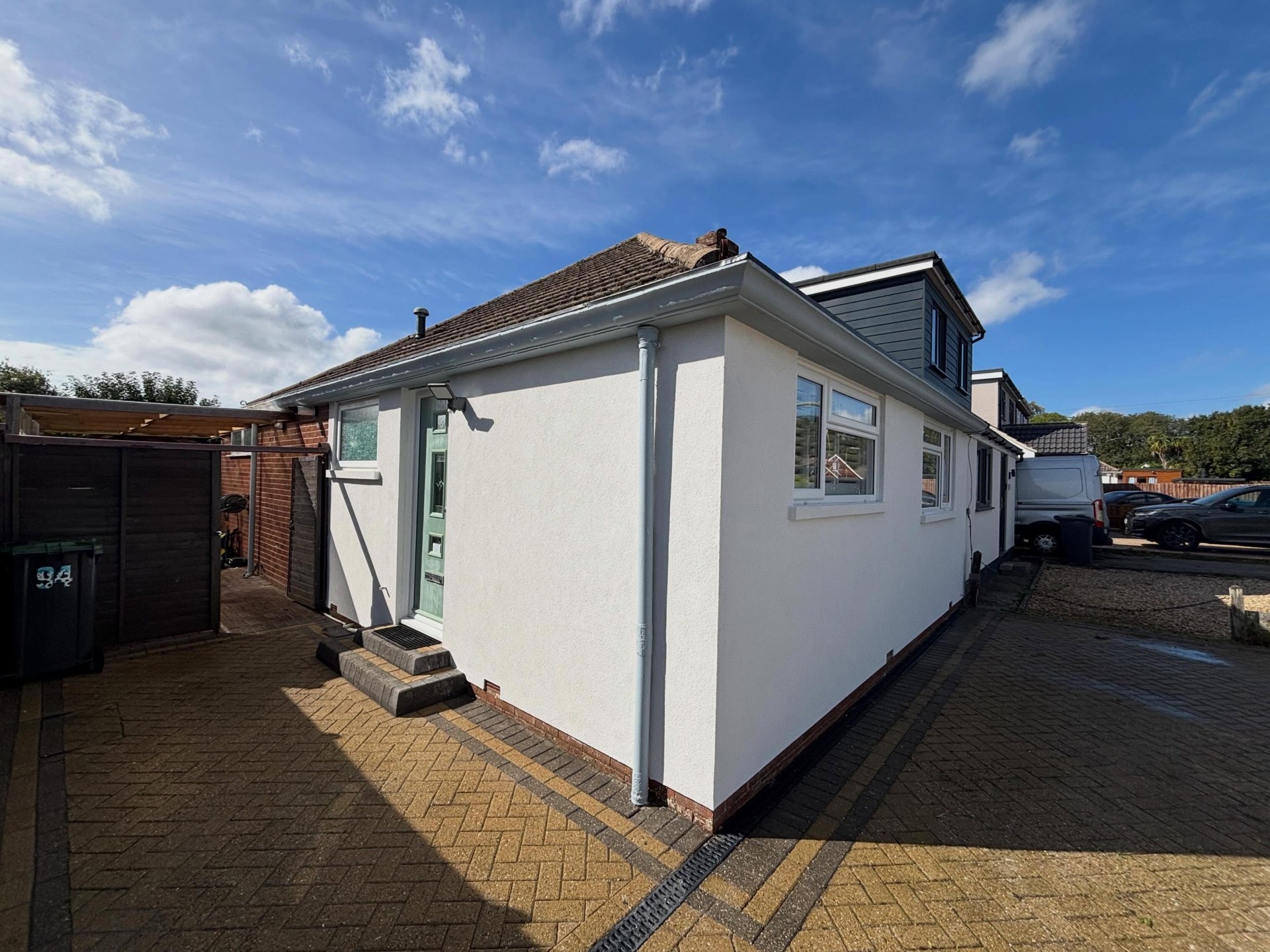 Bungalow transformed with fresh white external render by Ash Plastering, Hampshire